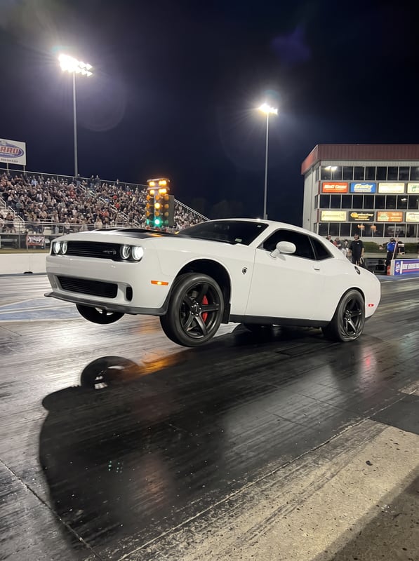 The same Hellcat rebuilt launching off the line at a drag strip